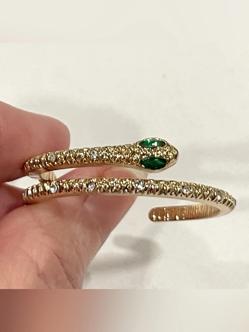 Gold Sparkle Snake Hoop Earrings with Green Eye Stone Accents